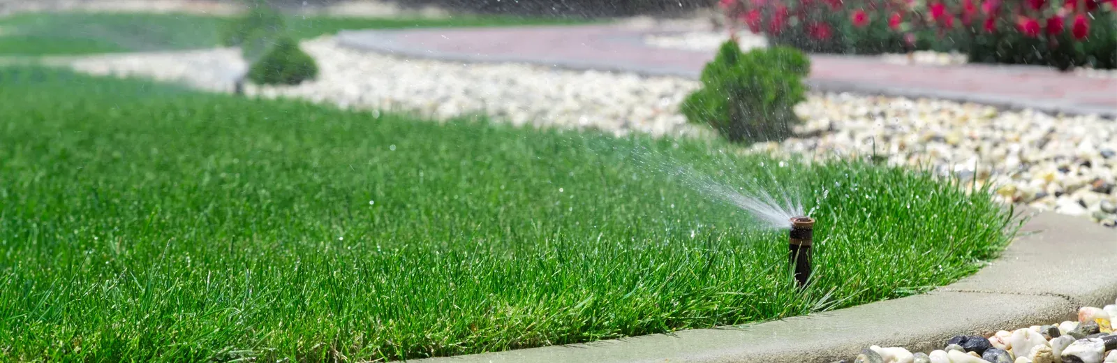 sprinkler system watering lawn